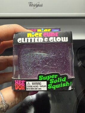 NeeDoh Nice Cube Glitter & Glow Super Solid Squish - Purple Glitter